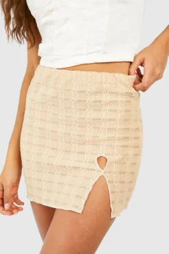 Jupe mini en jersey texturé avec détails découpés