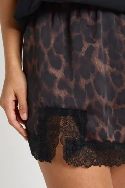 Jupe mini en satin avec bordure en dentelle léopard