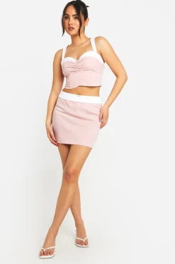 Jupe mini à taille contrastante avec détails floraux