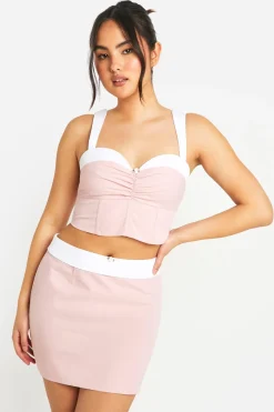 Jupe mini à taille contrastante avec détails floraux