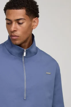 Mac oversize à la coupe carrée, doté d'un col et d'une fermeture éclair quarter zip