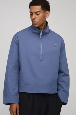 Mac oversize à la coupe carrée, doté d'un col et d'une fermeture éclair quarter zip