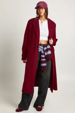 Manteau à l'aspect laine avec détail de manchette surdimensionnée