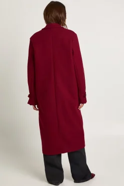 Manteau à l'aspect laine avec détail de manchette surdimensionnée
