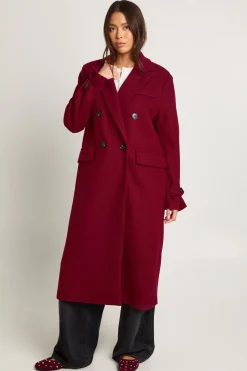 Manteau à l'aspect laine avec détail de manchette surdimensionnée