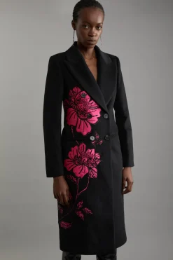 Manteau mi-long sur mesure à double boutonnage en mélange de laine avec appliques en satin embellies