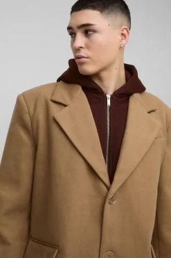 Manteau surdimensionné avec couche en jersey à capuche factice en beige