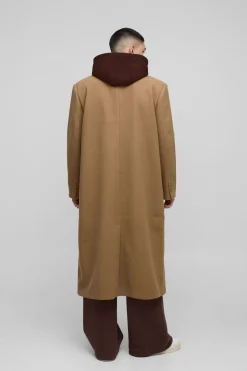 Manteau surdimensionné avec couche en jersey à capuche factice en beige