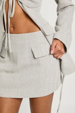 Mini-jupe avec détails de poche en motif chevron