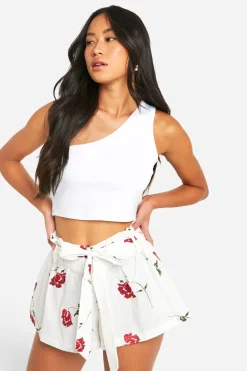 Mini jupe en coton fleuri à ceinture