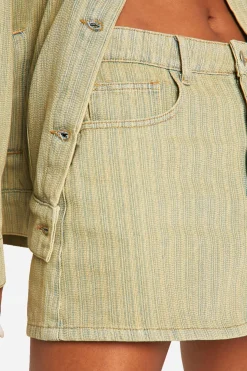 Mini jupe en jean délavé teinté