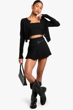 Mini-jupe plissée à détails de boucle