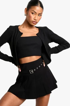 Mini-jupe plissée à détails de boucle