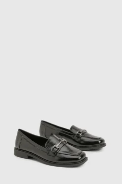 Mocassins coupe large avec détails en quincaillerie
