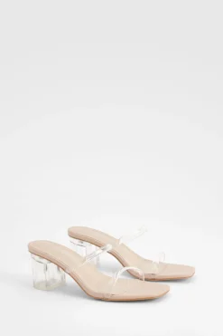 Mules à talon bloc bas transparent à coupe large