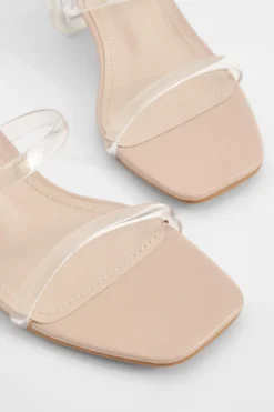 Mules à talon bloc bas transparent à coupe large