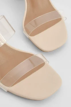 Mules à talon bloc, double bride transparente, coupe large