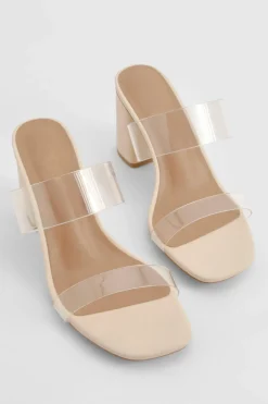 Mules à talon bloc, double bride transparente, coupe large