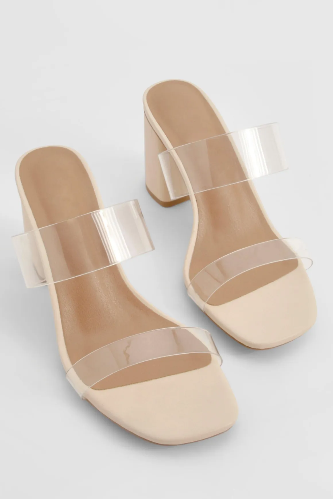 Mules à talon bloc, double bride transparente, coupe large