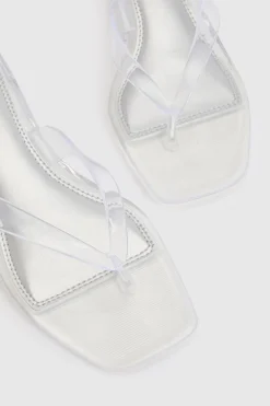 Mules À Talons Bas En Gelée Transparente Avec Bride Entre Les Orteils