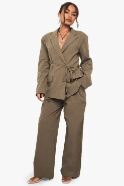 Pantalon ample en lin avec détails de perles et de nœud