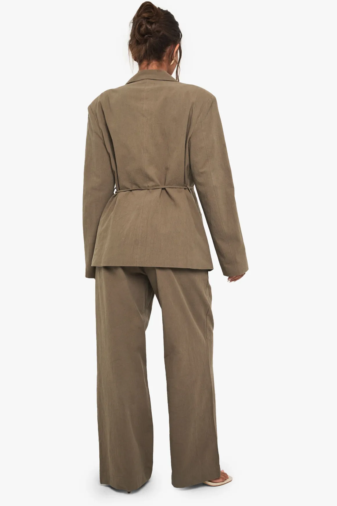 Pantalon ample en lin avec détails de perles et de nœud