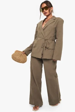 Pantalon ample en lin avec détails de perles et de nœud