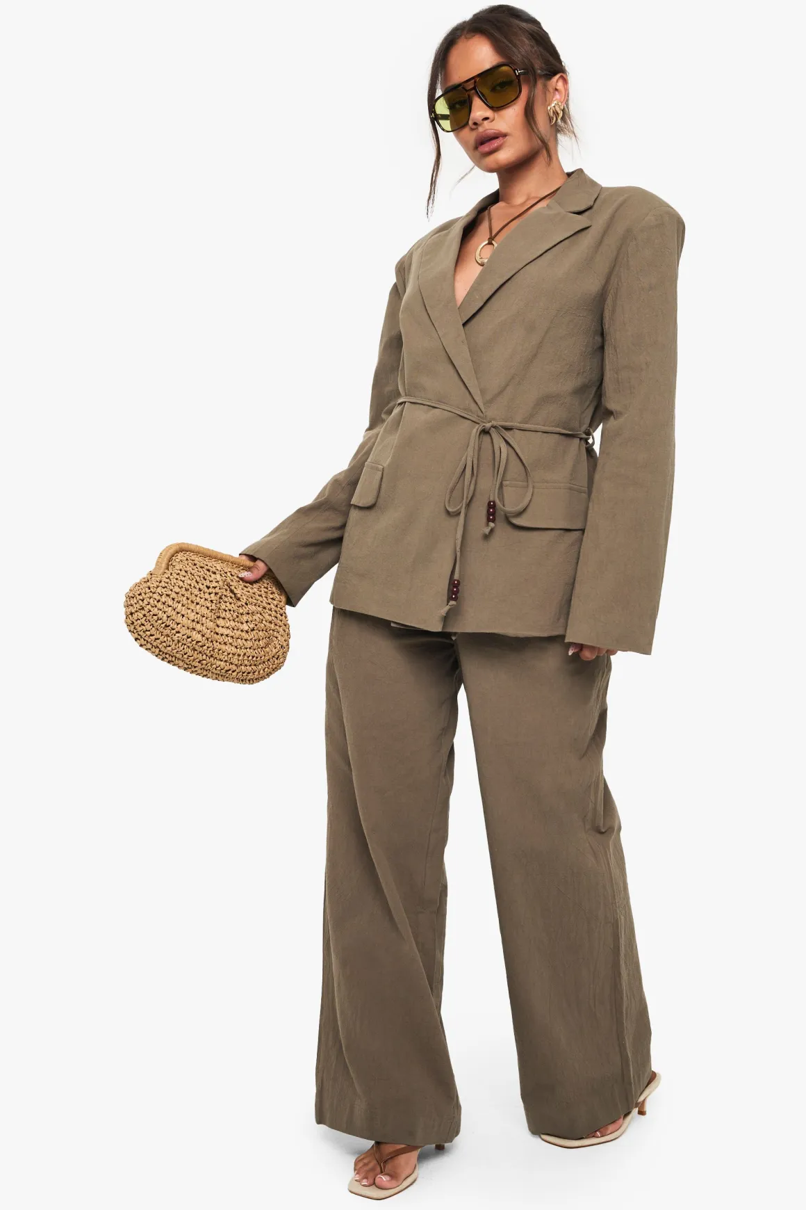 Pantalon ample en lin avec détails de perles et de nœud