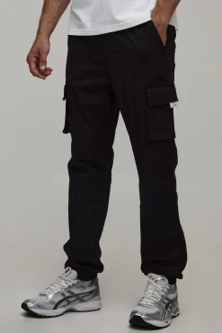 Pantalon cargo slim fit à taille élastiquée, patte tissée et revers aux chevilles