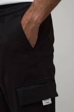 Pantalon cargo slim fit à taille élastiquée, patte tissée et revers aux chevilles