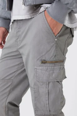 Pantalon cargo slim flare zippé surteint