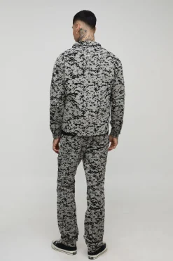 Pantalon à coupe droite en velours à motif de tapisserie et à plis superposés