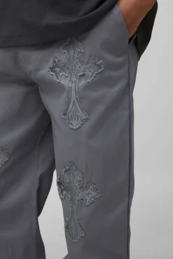 Pantalon décontracté long à taille fixe et appliqué croisé