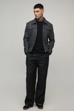 Pantalon de costume avec devant à plis hauts et jambes larges