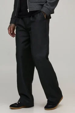 Pantalon de costume avec devant à plis hauts et jambes larges