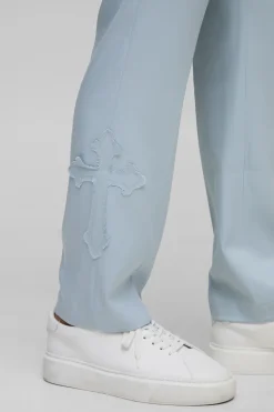 Pantalon de costume coupe droite à appliqué croisé