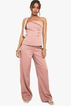 Pantalon droit à garniture dorée