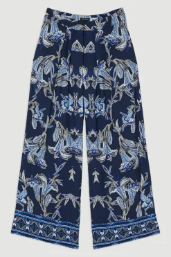 Pantalon droit tissé en viscose et lin à imprimé floral miroitant