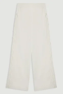 Pantalon en crêpe tissé avec bordures festonnées