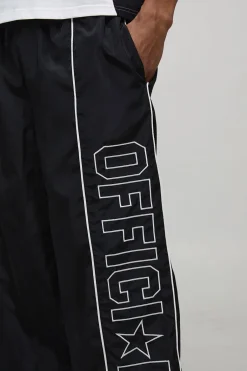 Pantalon en nylon oversize à détails de passepoil officiel