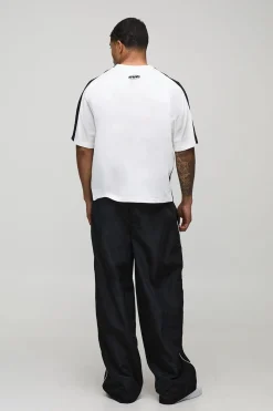 Pantalon en nylon oversize à détails de passepoil officiel