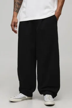 Pantalon en sergé lavé à coupe ballon et ceinture bicolore