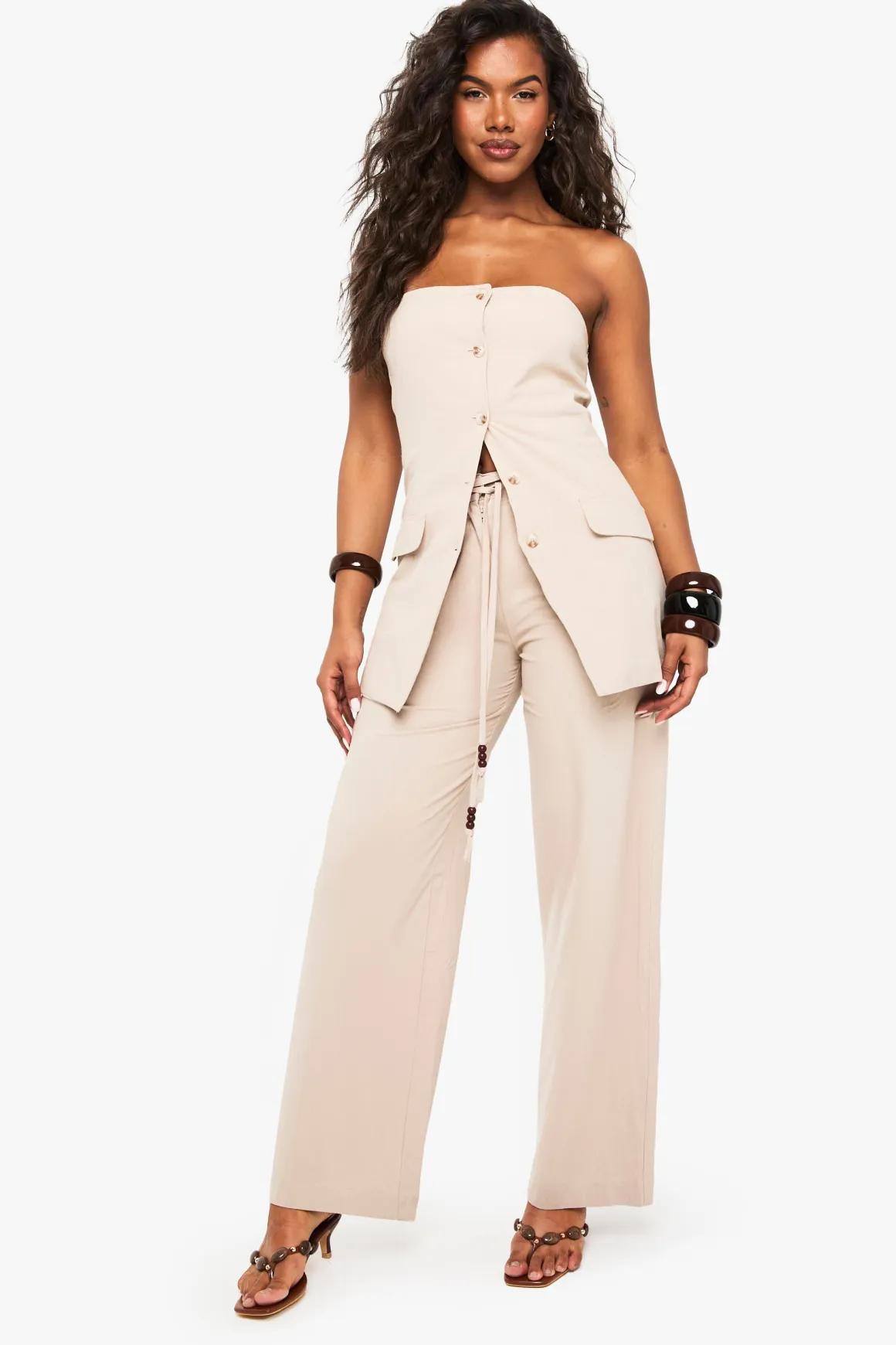 Pantalon à jambe large en lin orné de perles et à détails noués
