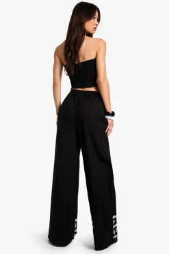 boohoo Pantalon à jambes larges pour grandes tailles à ourlet brodé<Femme Pantalons