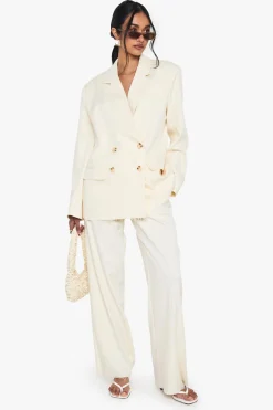 Pantalon à jambes larges sur mesure avec ourlet effiloché