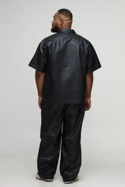 Pantalon à l'aspect cuir clouté, ourlet zippé, coupe décontractée