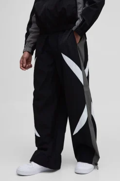 Pantalon parachute à taille élastiquée avec bande latérale