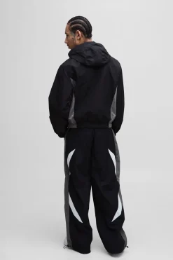 Pantalon parachute à taille élastiquée avec bande latérale