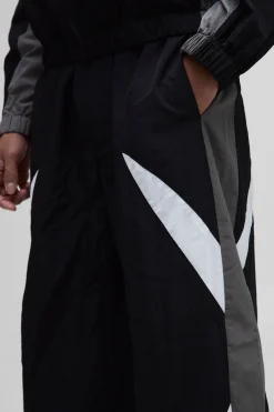 Pantalon parachute à taille élastiquée avec bande latérale