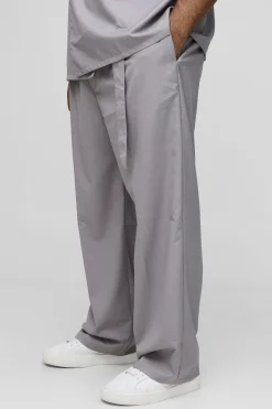 Pantalon à plis cintré, coupe décontractée pour grandes tailles avec ceinture